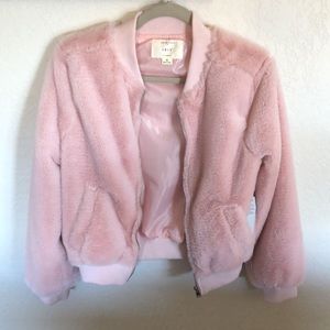 This is a Junior medium Super cute. Could be considered ex-small womens